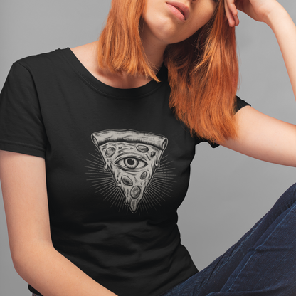 A woman with strawberry-blonde hair wearing a black t-shirt with a gray all-seeing eye pizza slice graphic, posed against a solid gray background.