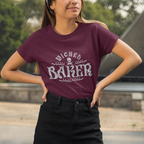 Woman wearing a purple t-shirt with 'Wicked Baker' design outdoors.