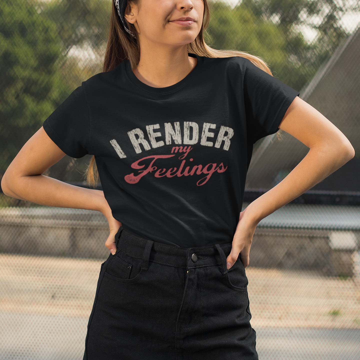 Person wearing a black t-shirt with 'I RENDER My Feelings' text, standing outdoors.
