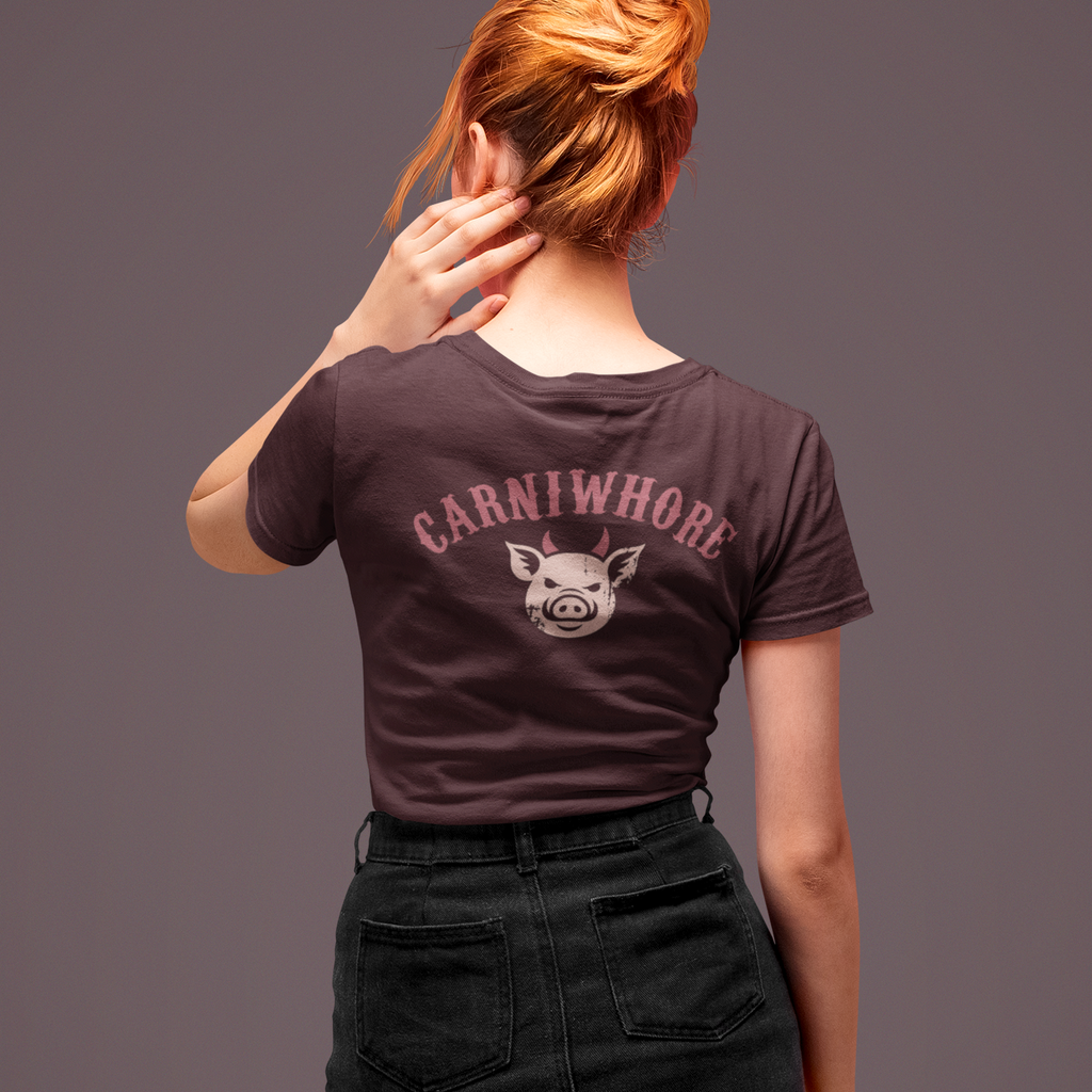 Person wearing a dark t-shirt with 'Carniwhore' design on the back against a gray background
