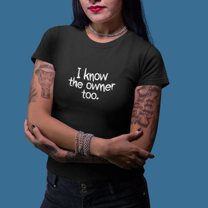 Woman wearing a black t-shirt with 'I know the owner too.' text against a blue background