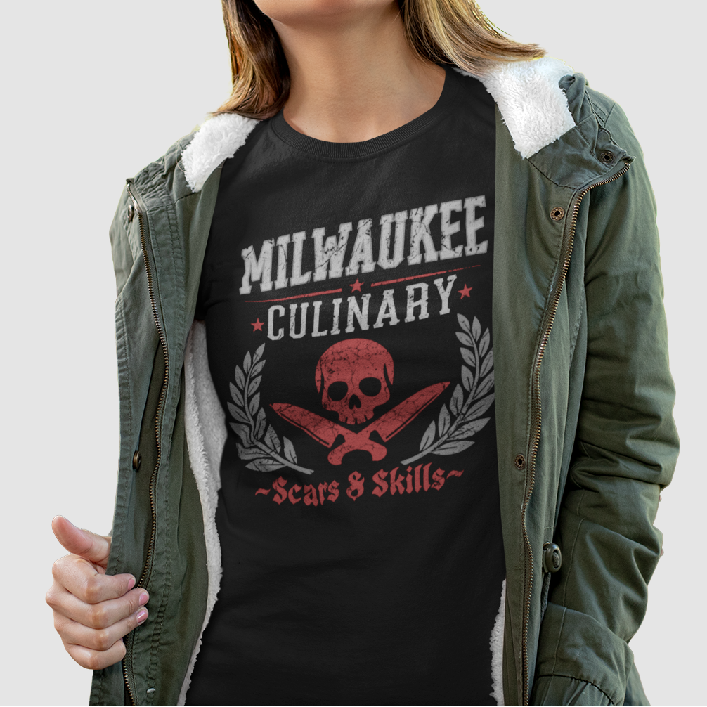 Person wearing a black t-shirt with 'Milwaukee Culinary' design, standing against a plain background